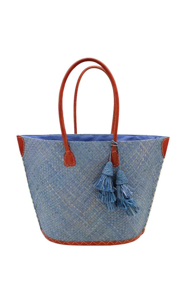 Santa Ynez Woven Small Straw Tote Bag with Tassel Charm Embellishment handmade woven raffia palm fiber in a solid hue of denim retro/light/blue with matching tassel tie charm embellishment and leather handles beach bag - Shebobo