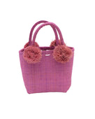 Schooner Straw Mini Bag with Pompom Accent handmade loomed natural raffia palm fiber in a solid hue of Lilas lilac/wisteria/light/purple with four matching raffia pompom embellishments at the base of each handle attachment tiny purse extra small handbag - Shebobo