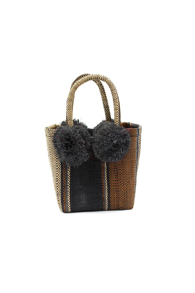 Schooner Black/Cinnamon Swirl Straw Mini Bag with Pompom Accent handmade loomed natural raffia palm fiber in multi width vertical multicolor stripe pattern of black, cinnamon/tobacco/brown, grey, and natural straw color with four matching raffia pompom embellishments at the base of each handle attachment tiny purse extra small handbag - Shebobo