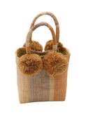 Schooner Blush Swirl Straw Mini Bag with Pompom Accent handmade loomed natural raffia palm fiber in multi width vertical multicolor stripe pattern of blush orange/pink, grey, and natural straw color with four matching raffia pompom embellishments at the base of each handle attachment tiny purse extra small handbag - Shebobo