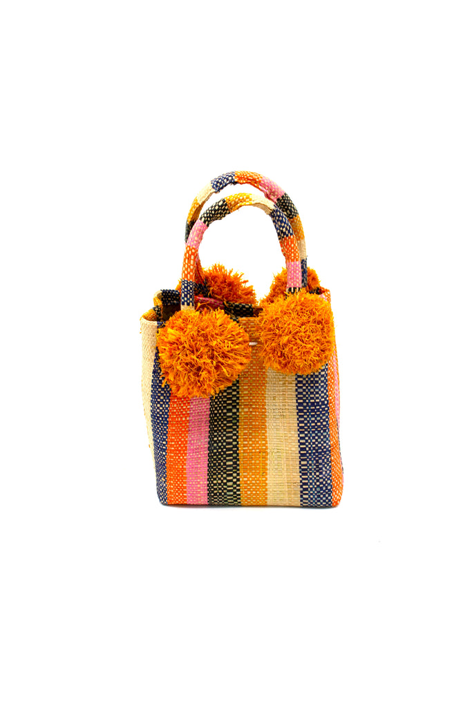 Schooner Candy Land Stripe Straw Mini Bag with Pompom Accent handmade loomed natural raffia palm fiber in multi width vertical multicolor stripe pattern of orange, pink, black, saffron, natural straw color, blue, etc. with four matching raffia pompom embellishments at the base of each handle attachment tiny purse extra small handbag - Shebobo