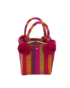 Schooner Fuchsia Stripe Straw Mini Bag with Pompom Accent handmade loomed natural raffia palm fiber in multi width vertical multicolor stripe pattern of fuchsia hot/bright/barbie pink, midori lime/green, saffron orange/yellow, red, black, etc. with four matching raffia pompom embellishments at the base of each handle attachment tiny purse extra small handbag - Shebobo