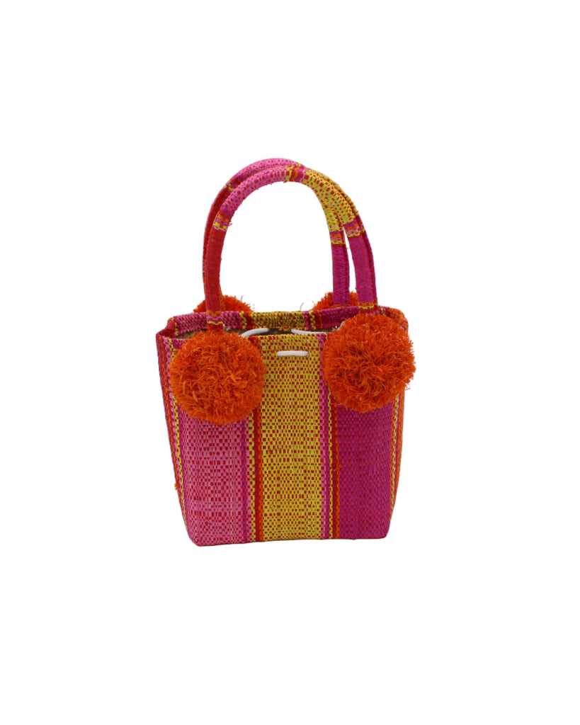 Schooner Fuchsia Yellow Stripe Straw Mini Bag with Pompom Accent handmade loomed natural raffia palm fiber in multi width vertical multicolor stripe pattern of  fuchsia hot/bright/barbie/pink, coral orange/red, yellow, pink, and red with four matching raffia pompom embellishments at the base of each handle attachment tiny purse extra small handbag - Shebobo