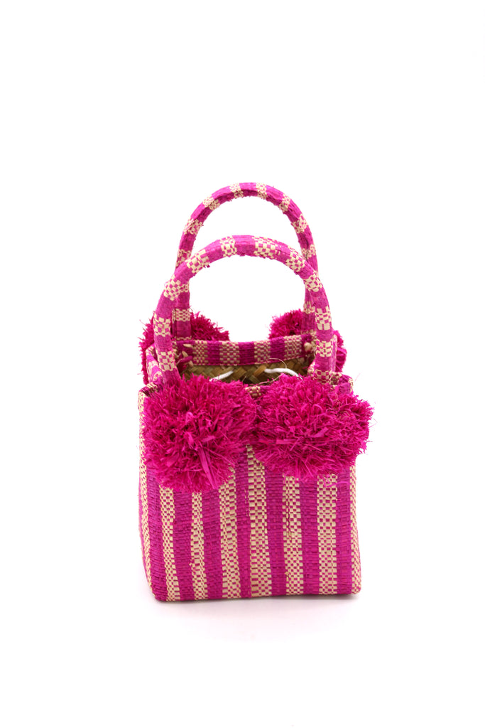 Schooner Fuchsia Stripe Straw Mini Bag with Pompom Accent handmade loomed natural raffia palm fiber in two tones of fuchsia hot/bright/barbie pink and natural straw color vertical stripe pattern with four matching raffia pompom embellishments at the base of each handle attachment tiny purse extra small handbag - Shebobo