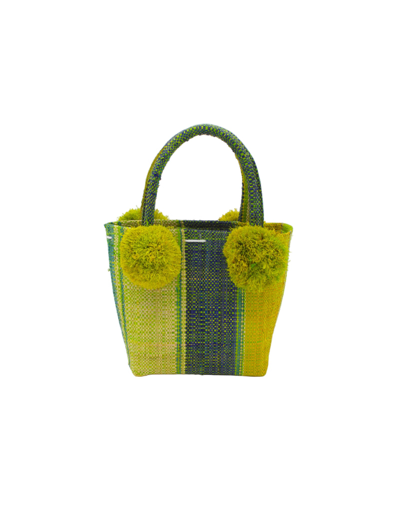 Schooner Izarra Swirl Straw Mini Bag with Pompom Accent handmade loomed natural raffia palm fiber in multi width vertical multicolor stripe pattern of midori lime/green, dusk navy/blue, yellow, and teal with four matching raffia pompom embellishments at the base of each handle attachment tiny purse extra small handbag - Shebobo