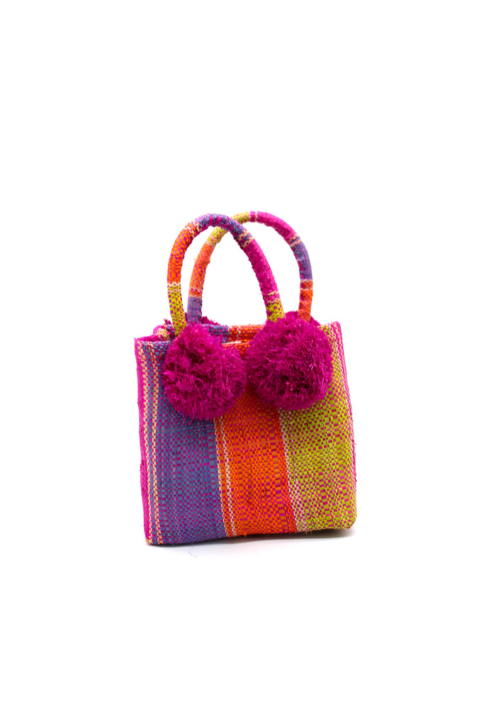 Schooner Midori Swirl Straw Mini Bag with Pompom Accent handmade loomed natural raffia palm fiber in multi width vertical multicolor stripe pattern of purple, orange, natural straw color, fuchsia bright/hot/barbie/pink, lime green, etc. with four matching raffia pompom embellishments at the base of each handle attachment tiny purse extra small handbag - Shebobo