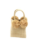Schooner Straw Mini Bag with Pompom Accent handmade loomed natural raffia palm fiber in a solid hue of natural straw color with four matching raffia pompom embellishments at the base of each handle attachment tiny purse extra small handbag - Shebobo