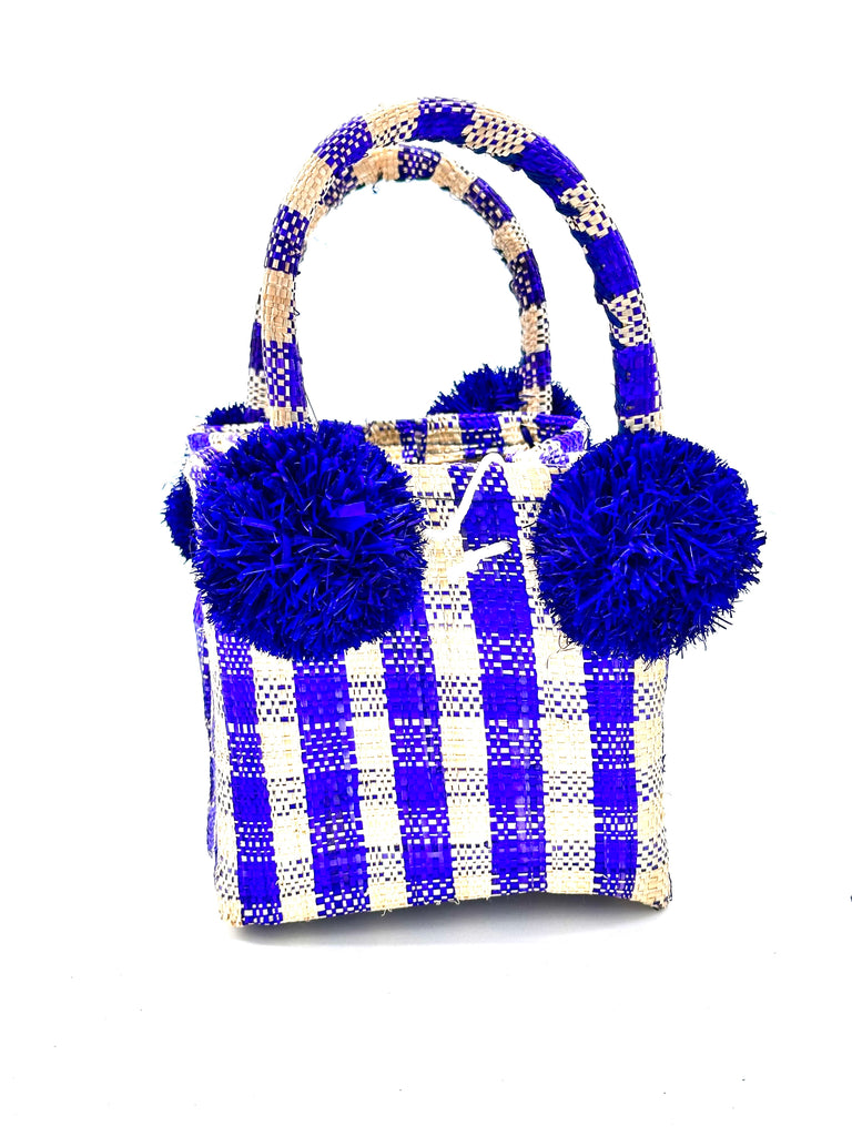 Schooner Navy Gingham Straw Mini Bag with Pompom Accent handmade loomed natural raffia palm fiber in two tones of navy blue and natural straw color small gingham plaid pattern with four navy raffia pompom embellishments at the base of each handle attachment tiny purse extra small handbag - Shebobo