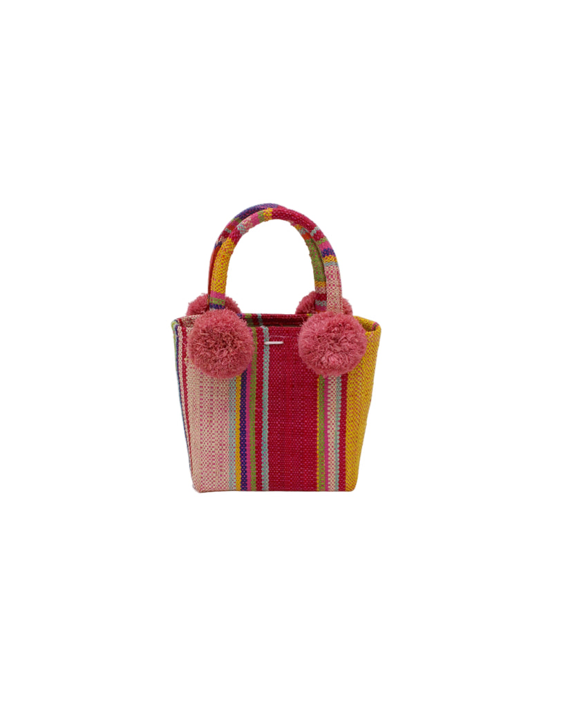 Schooner Raspberry Swirl Straw Mini Bag with Pompom Accent handmade loomed natural raffia palm fiber in multi width vertical multicolor stripe pattern of light pink, red, yellow, purple, seafoam, lime green, fuchsia, orange, and natural straw color with four matching raffia pompom embellishments at the base of each handle attachment tiny purse extra small handbag - Shebobo