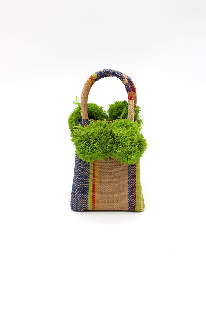 Schooner Rio Swirl Straw Mini Bag with Pompom Accent handmade loomed natural raffia palm fiber in multi width vertical multicolor stripe pattern of purple, red, blue, cappuccino light brown, natural straw color, saffron yellow, lime green, etc. with four matching raffia pompom embellishments at the base of each handle attachment tiny purse extra small handbag - Shebobo