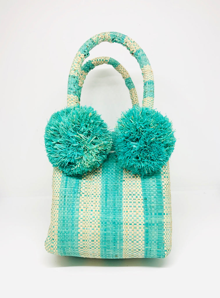 Schooner Seafoam Stripe Straw Mini Bag with Pompom Accent handmade loomed natural raffia palm fiber in two tones of seafoam blue/green and natural straw color vertical stripe pattern with four seafoam raffia pompom embellishments at the base of each handle attachment tiny purse extra small handbag - Shebobo