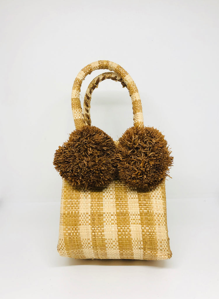 Schooner Straw Mini Bag with Pompom Accent handmade loomed raffia in a petite gingham pattern of cinnamon/tobacco/brown and natural small handbag with four solid brown color pompom embellishments attached at the handles purse - Shebobo