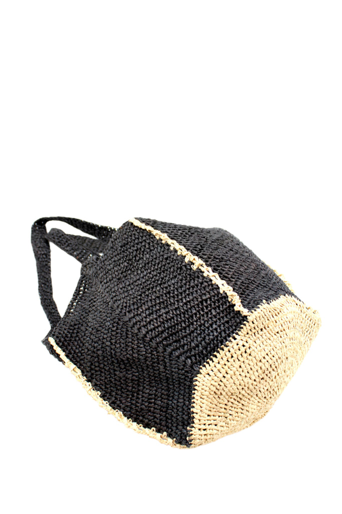 Bottom View Sea See Black Straw Shoulder Bag handmade woven raffia palm fiber in a solid hue of black making a diagonal link pattern with  natural straw color crochet circular bottom and vertical edging along the side panels creating a two tone multicolor handbag/beach bag/purse - Shebobo