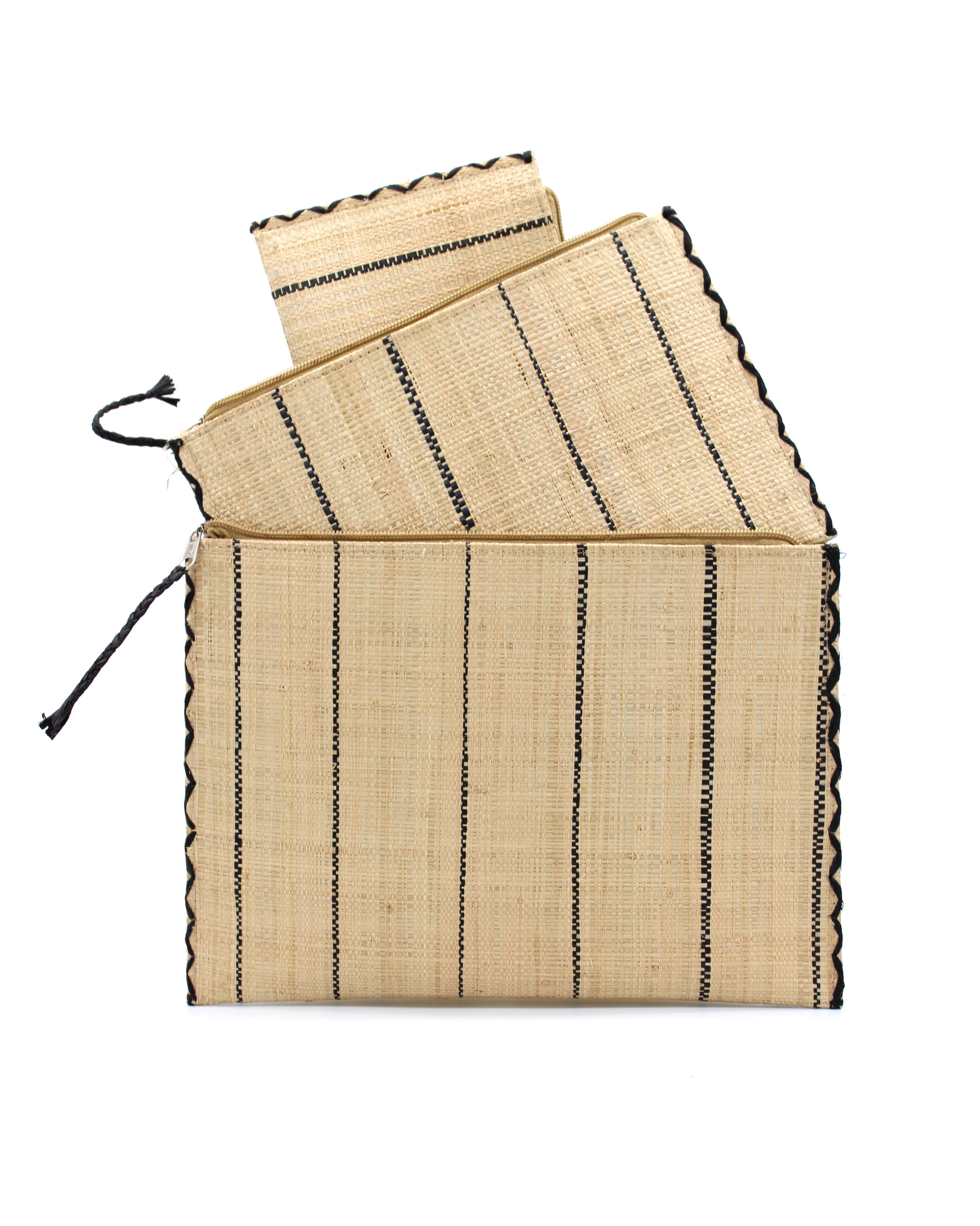 Set of 3 Natural Nesting Zippered Straw Clutches Pinstripe Pattern handmade loomed raffia in wide vertical bands of natural straw color with narrow bands of black with matching zipper and braided zipper pull with cross stitch edging in three sizes of small, medium, and large - Shebobo