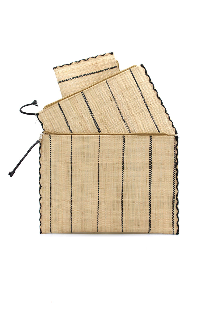 Set of 3 Natural Nesting Zippered Straw Clutches Pinstripe Pattern handmade loomed raffia in wide vertical bands of natural straw color with narrow bands of black with matching zipper and braided zipper pull with cross stitch edging in three sizes of small, medium, and large - Shebobo