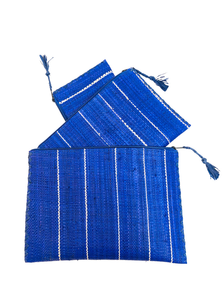 Set of 3 Navy Blue Nesting Zippered Straw Clutches Pinstripe Pattern handmade loomed raffia in wide vertical bands of blue with narrow bands of natural straw color with matching zipper and braided zipper pull with cross stitch edging in three sizes of small, medium, and large - Shebobo
