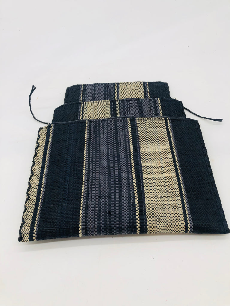 Set of 3 Nesting Zippered Straw Clutches Black Swirl Multicolor Stripe Pattern handmade loomed raffia in multiple widths of vertical stripes in natural, black, and grey with matching zipper and braided zipper pull with cross stitch edging in three sizes of small, medium, and large - Shebobo