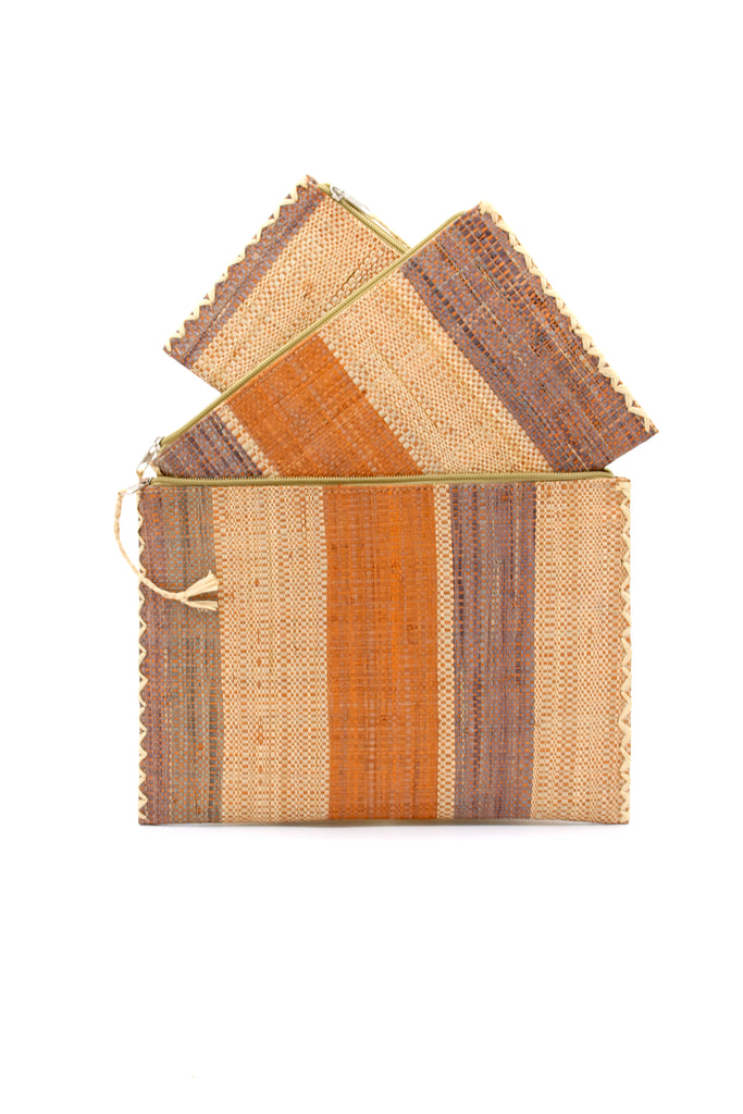 Set of 3 Nesting Zippered Straw Clutches Blush Swirl Multicolor Stripe Pattern handmade loomed raffia in multiple widths of vertical stripes in natural, blush orange/pink, and grey with matching zipper and braided zipper pull with cross stitch edging in three sizes of small, medium, and large - Shebobo