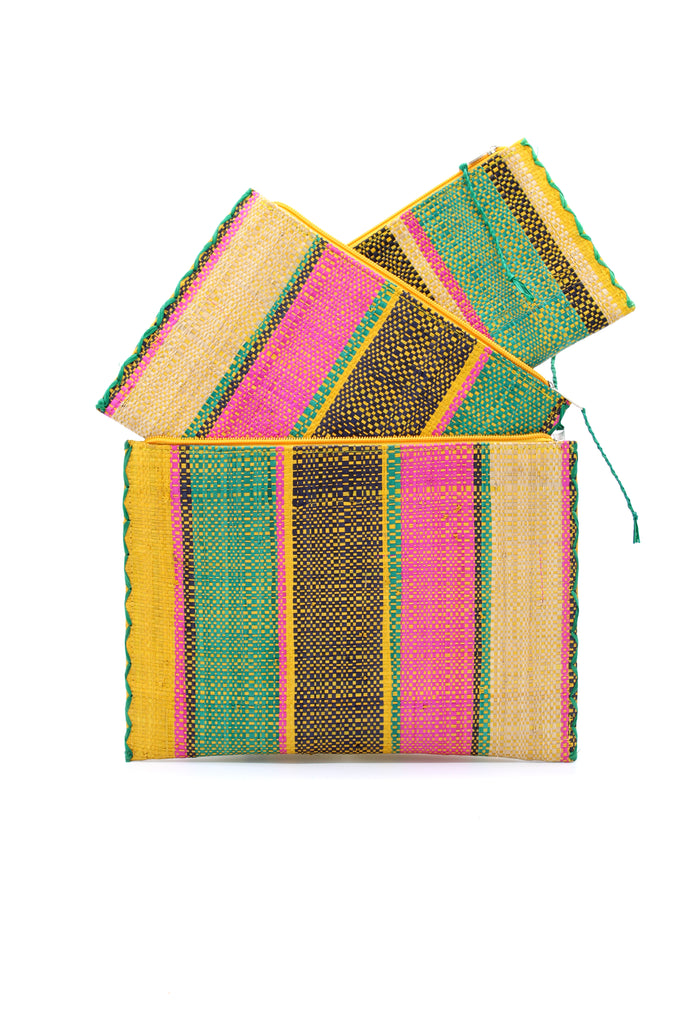 Set of 3 Nesting Zippered Straw Clutches Carmalita Multicolor Stripe Pattern handmade loomed raffia in multiple widths of vertical stripes in turquoise, black, fuchsia, and saffron with matching zipper and braided zipper pull with cross stitch edging in three sizes of small, medium, and large - Shebobo