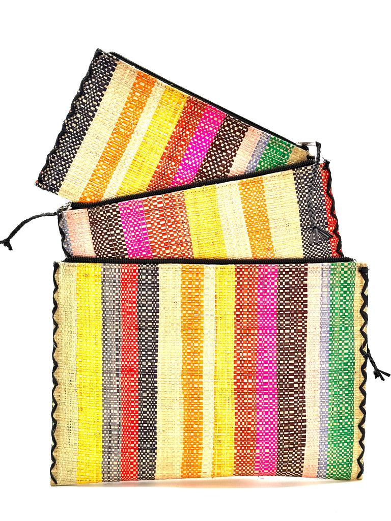 Set of 3 Nesting Zippered Straw Clutches Lollipop Multicolor Stripe Pattern handmade loomed raffia in multiple widths of vertical stripes in natural, orange, green, saffron, light blue, red, fuchsia, pink, black, grey, etc. with matching black zipper and braided zipper pull with cross stitch edging in three sizes of small, medium, and large - Shebobo