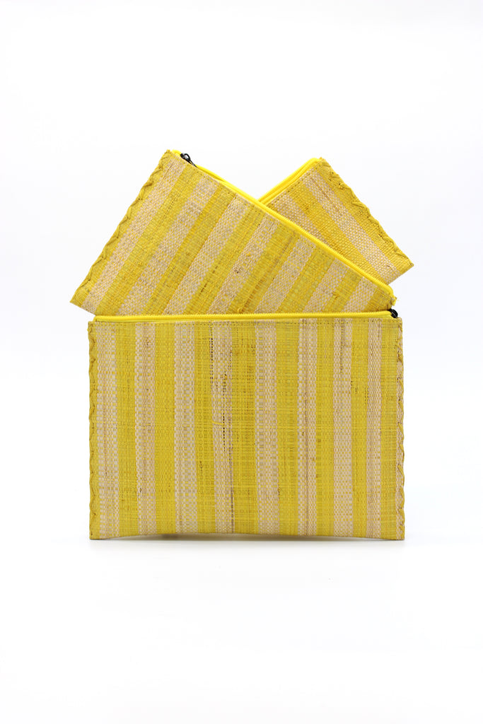 Set of 3 Nesting Zippered Straw Clutches Yellow Multicolor Stripe Pattern handmade loomed raffia in vertical stripes of bright yellow and natural straw color with matching zipper and braided zipper pull with cross stitch edging in three sizes of small, medium, and large - Shebobo