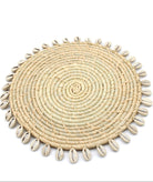 Detail view Makena Round Crochet Natural Raffia Straw Placemats handmade woven raffia palm fiber in a solid hue of natural straw color with coiled loop texture discs with cowrie shell edge embellishment set of six - Shebobo