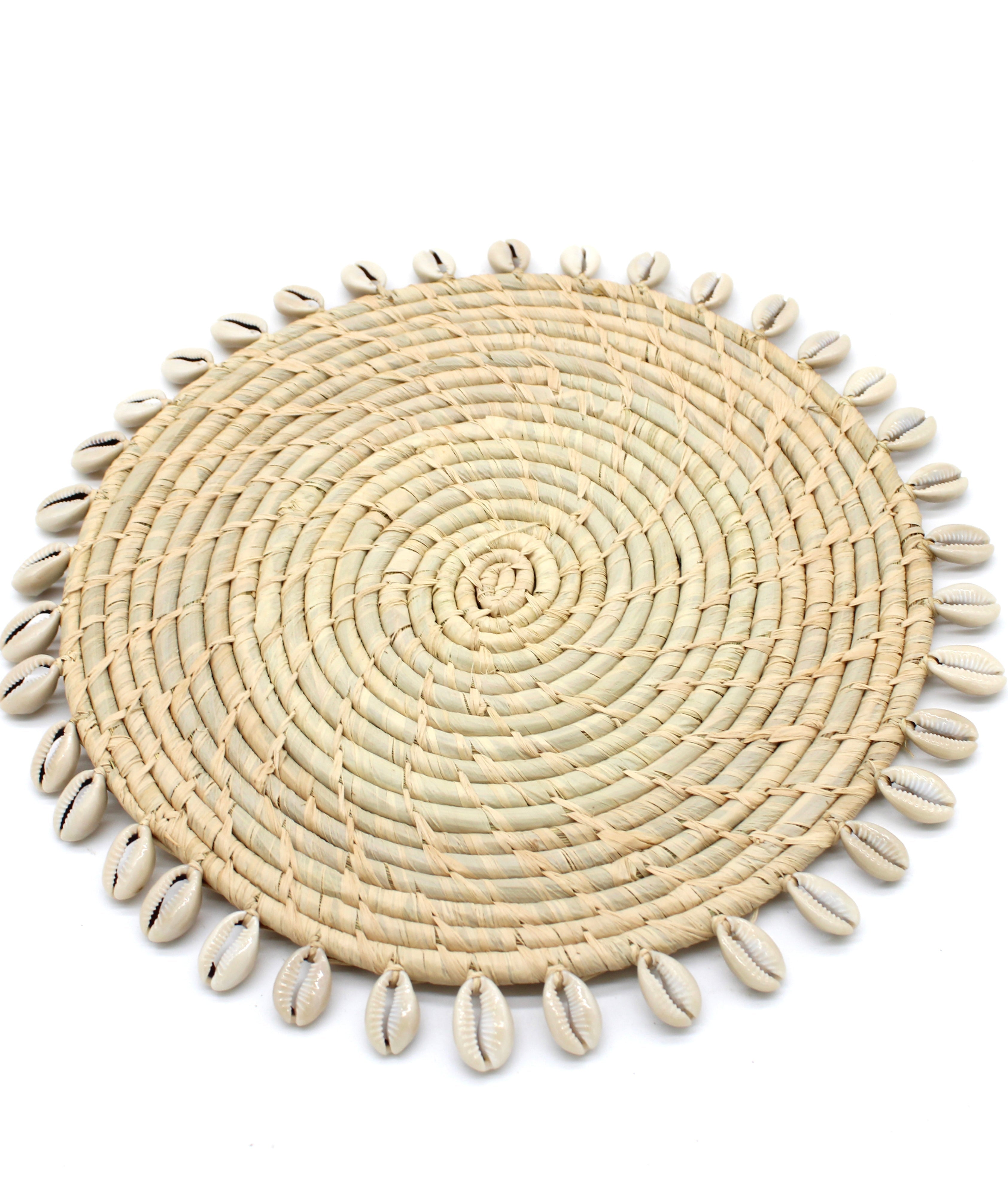 Detail view Makena Round Crochet Natural Raffia Straw Placemats handmade woven raffia palm fiber in a solid hue of natural straw color with coiled loop texture discs with cowrie shell edge embellishment set of six - Shebobo