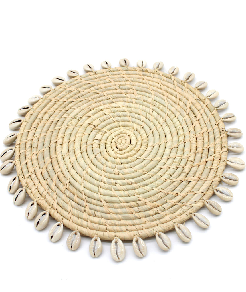 Detail view Makena Round Crochet Natural Raffia Straw Placemats handmade woven raffia palm fiber in a solid hue of natural straw color with coiled loop texture discs with cowrie shell edge embellishment set of six - Shebobo