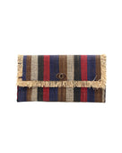Sophie Dark & Moody Multicolor Stripe Straw Clutch handmade loomed raffia purse handbag with raw fringe edge detailing black, natural, cinnamon/tobacco/brown, red, and navy blue multicolor vertical stripe pattern envelope shaped bag - Shebobo