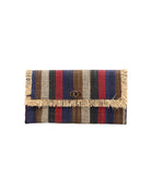 Sophie Dark & Moody Multicolor Stripe Straw Clutch handmade loomed raffia purse handbag with raw fringe edge detailing black, natural, cinnamon/tobacco/brown, red, and navy blue multicolor vertical stripe pattern envelope shaped bag - Shebobo