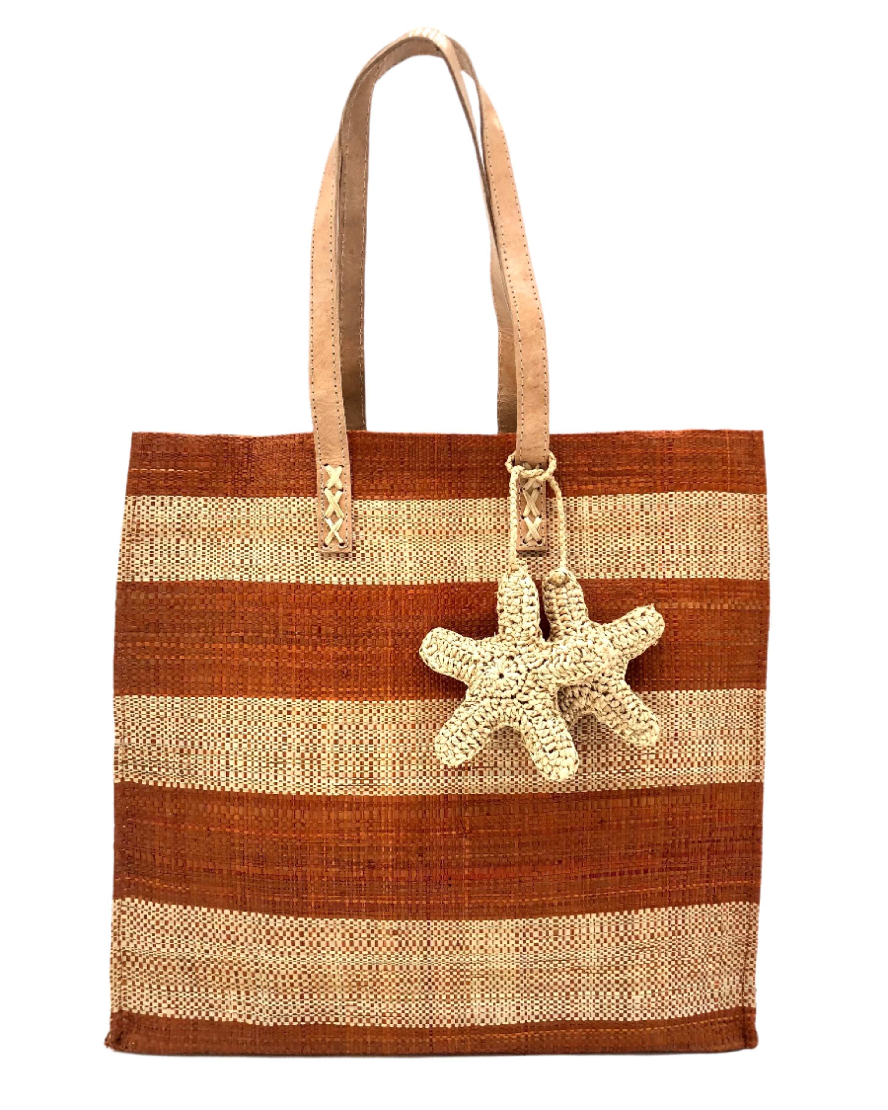 Starfish Whisky Straw Bag with Crochet Starfish Charm Embellishment handmade loomed raffia shopping tote in whisky red/brown and natural straw color horizontal wide stripe pattern handbag with leather handles - Shebobo