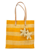 Starfish Straw Bag with Crochet Starfish Charm Embellishment handmade loomed raffia shopping tote in saffron yellow and natural straw color horizontal wide stripe pattern handbag with leather handles - Shebobo