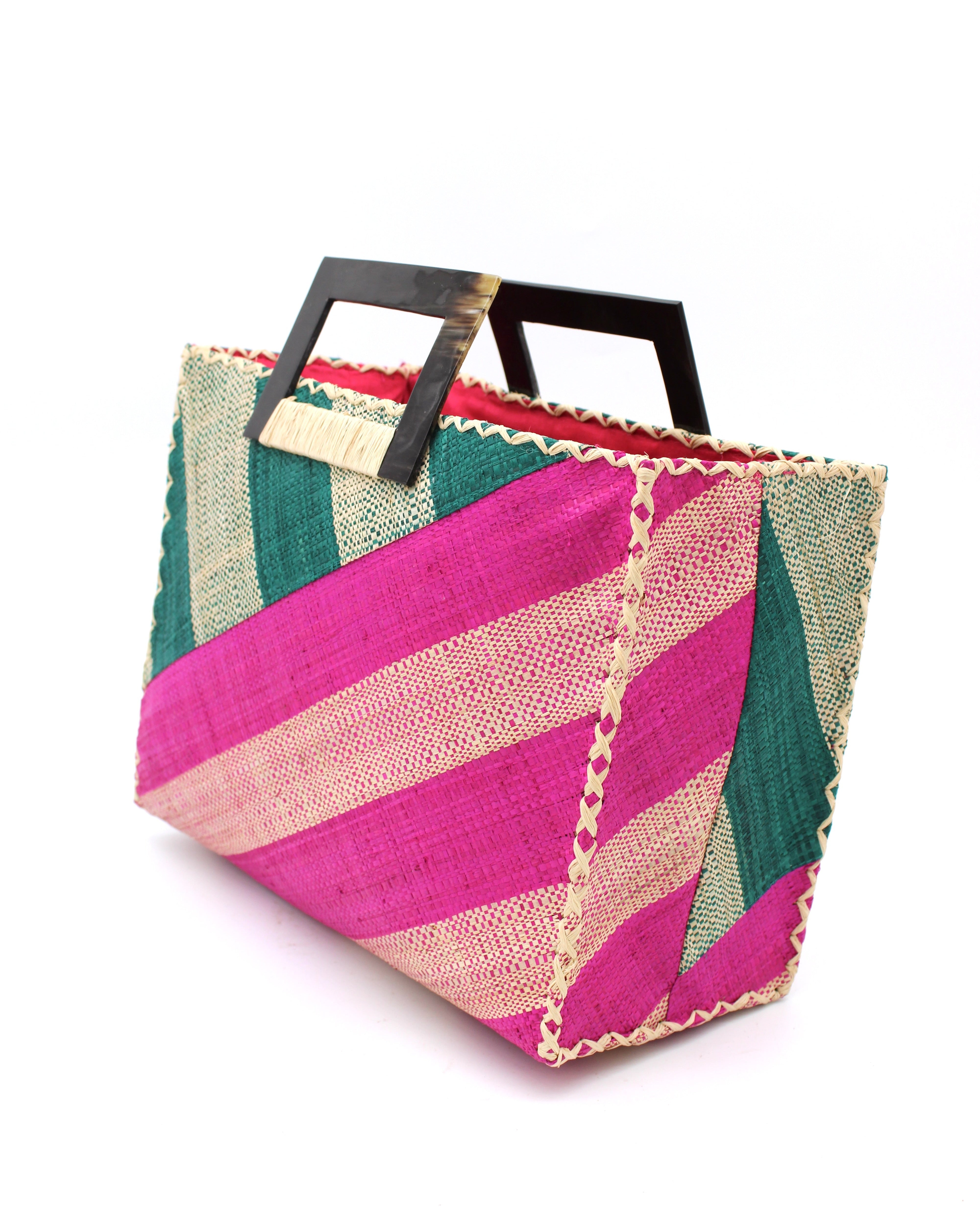 Side View Stevie Double Wide Stripe Fuchsia & Teal Square Straw Handbag with Horn Handles handmade loomed raffia palm fiber in even width wide stripe pattern of Fuchsia hot/bright/barbie/pink and natural straw color oriented on the diagonal of three quarters of the bag with matching stripe pattern of Teal dark/blue/green and natural diagonally on the top left corner quarter shoulder bag handbag - Shebobo
