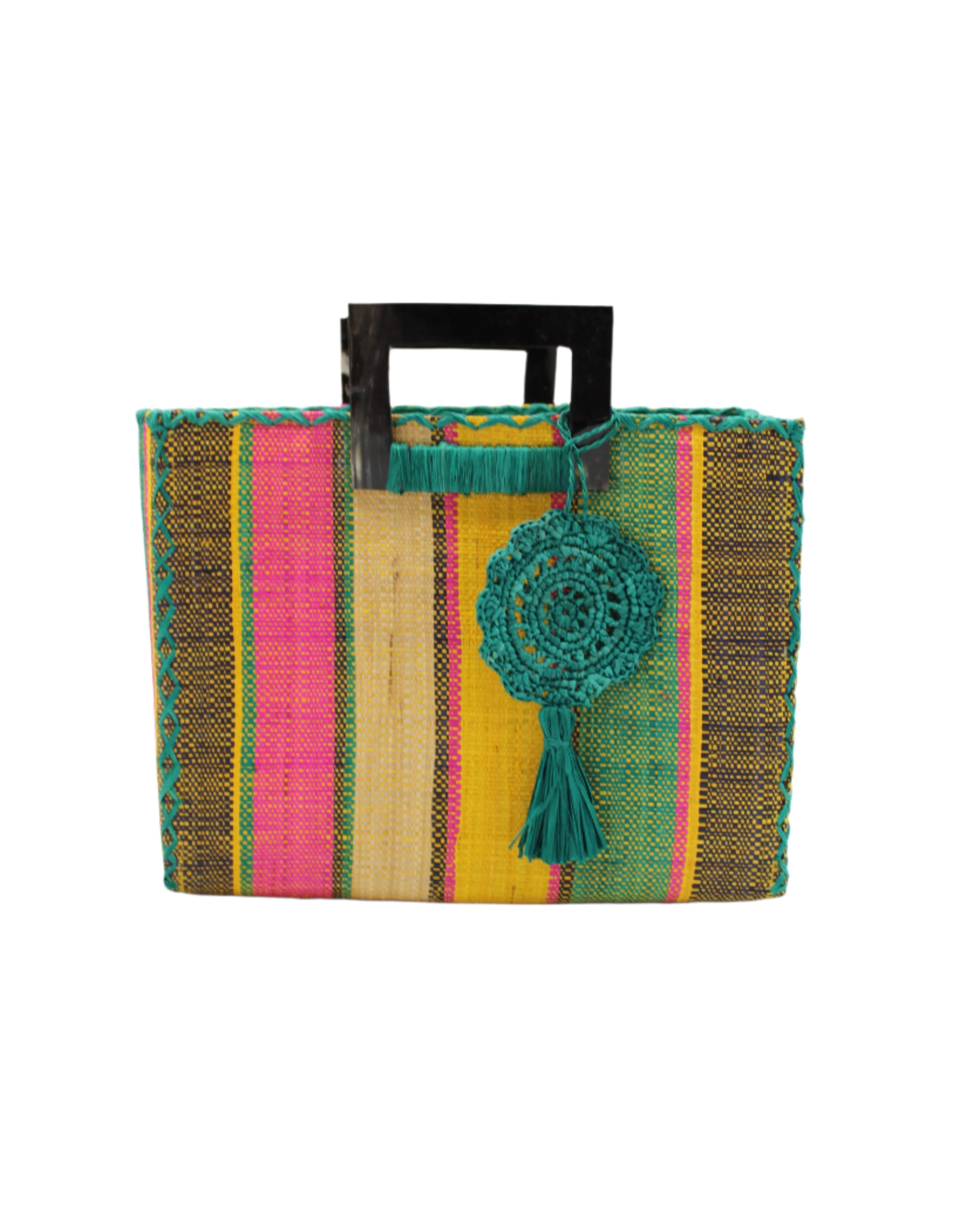 Stevie Square Carmalita Multicolor Stripe Straw Handbag with Horn Handles handmade loomed raffia with saffron yellow, turquoise blue, fuchsia pink, naural, and black varying width vertical stripe pattern purse with matching turquoise liner, cross stitch edging, handle attachment, and crochet doily tassel charm embellishment - Shebobo