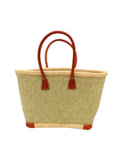 Tan Tan Woven Rush Straw Basket Tote Bag handmade woven natural rush fibers in a solid hue of seagrass light/green/natural reed color with looped raffia palm fiber top and bottom edging in natural straw color plus leather handles and feet handbag beach bag - Shebobo