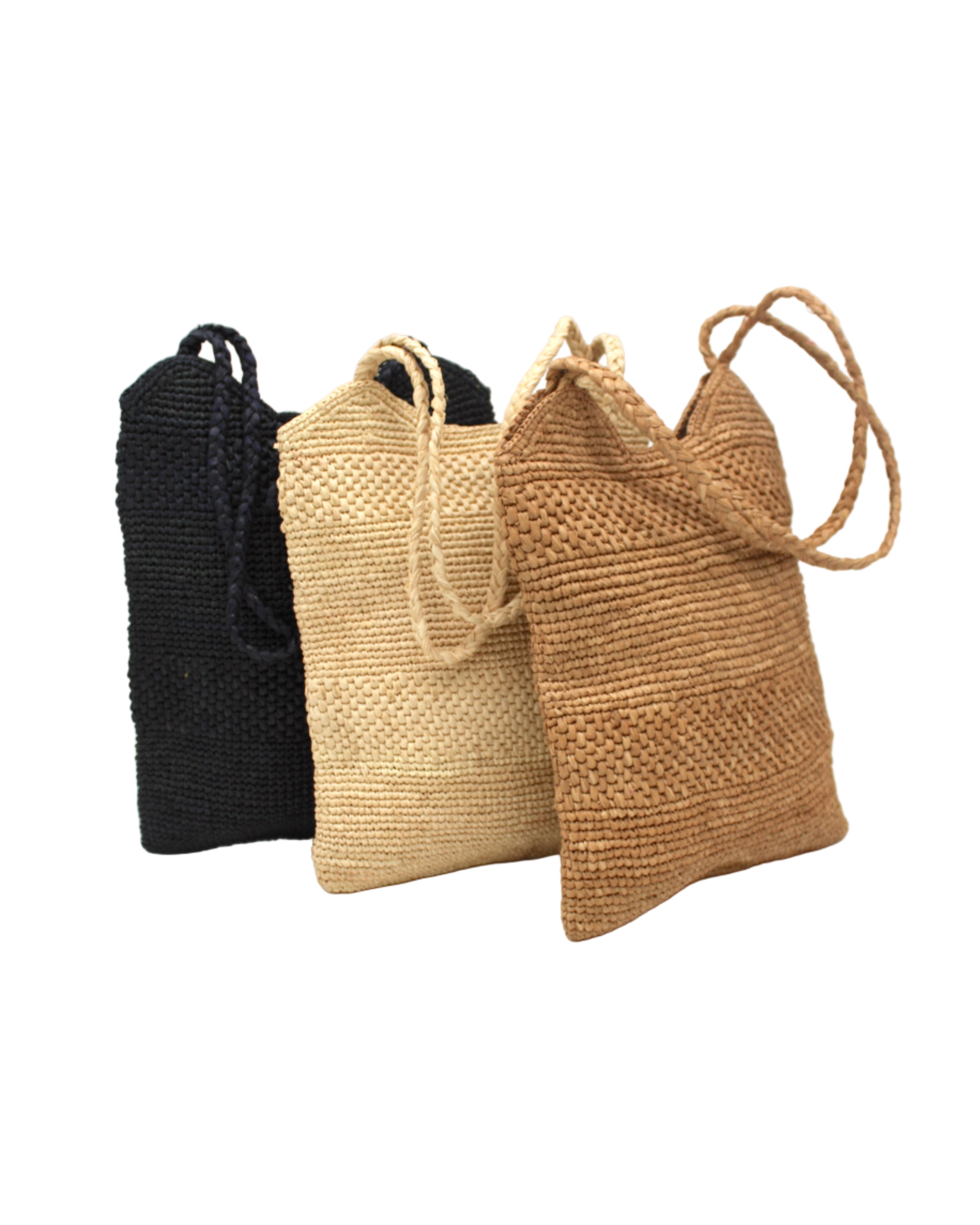 Color options of Tiana Crochet Straw Shoulder Bag Purse handmade crochet natural raffia palm fiber in a solid hue of Black, Natural straw color, or Cappuccino tea/light/brown in subtle textured horizontal bands of two link patterns with matching braided handles - Shebobo