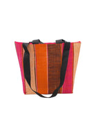 Tiburon Whimsy Swirl Straw Duffle Bag Shoulder & Handbag Combination handmade loomed natural raffia palm fiber in a multicolor vertical stripe pattern of multi width bands of black, fuchsia pink, coral orange/red, and natural straw color, etc. with four black webbing handles sports tote bag purse - Shebobo