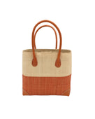 Trinidad Natural and Blush Two Tone Straw Basket Bag handmade loomed raffia palm fiber in a two tone color block pattern with blush light/orange/pink on the bottom half and natural straw color on the top half of the bag with leather handles and accents beach bag tote purse - Shebobo