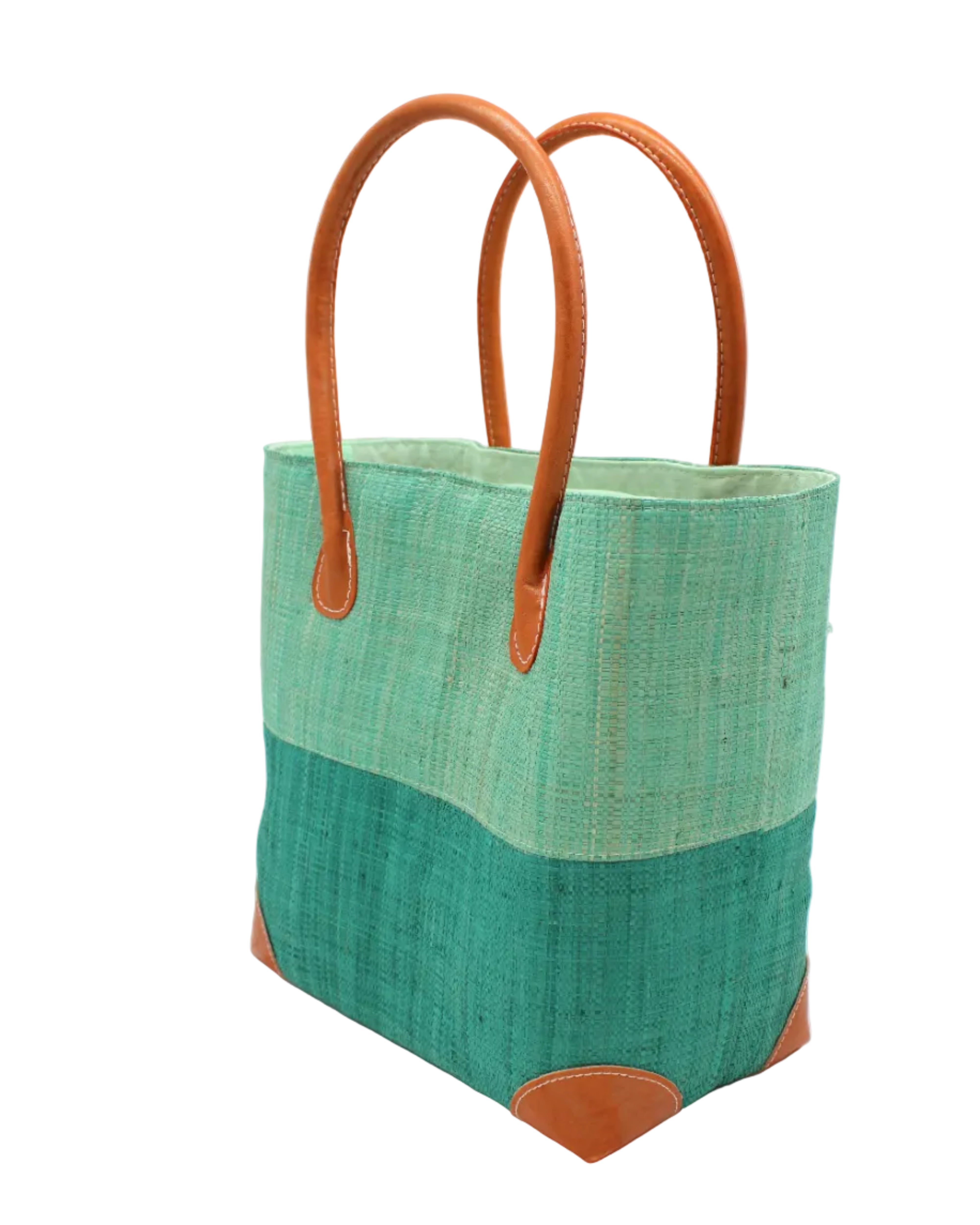 Side view Trinidad Seafoam and Teal Two Tone Straw Basket Bag handmade loomed raffia palm fiber in a two tone color block pattern with teal dark/blue/green on the bottom half and seafoam light/blue/green on the top half of the bag with leather handles and accents beach bag tote purse - Shebobo