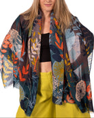Model wearing Tropical Forest Scarf Wrap Grey & Teal Multicolor leaves and floral pattern with grey, orange, blue, teal, beige, yellow, etc. - Shebobo