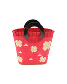 Tulum Straw Bucket Bag with Flower Embroidery and Horn Handle Red Purse with Ruffle Edge handmade loomed raffia palm fiber in a solid hue of red with natural straw color hand embroidered floral pattern with multiple sized flowers and raffia ruffle on the opening  handbag - Shebobo