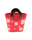 Tulum Straw Bucket Bag with Flower Embroidery and Horn Handle Red Purse with Ruffle Edge handmade loomed raffia palm fiber in a solid hue of red with natural straw color hand embroidered floral pattern with multiple sized flowers and raffia ruffle on the opening  handbag - Shebobo