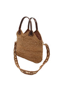 Side view Victoria Crochet Straw Handbag Convertible Crossbody Bag handmade crochet natural raffia palm fiber in a solid hue of cappuccino tea/light/brown in a subtle texture of horizontal link bands pattern across the bag and m shape around the top of the bag with dark brown leather handles and removable two tone natural and cappuccino tea/light/brown crossbody strap convertible purse - Shebobo