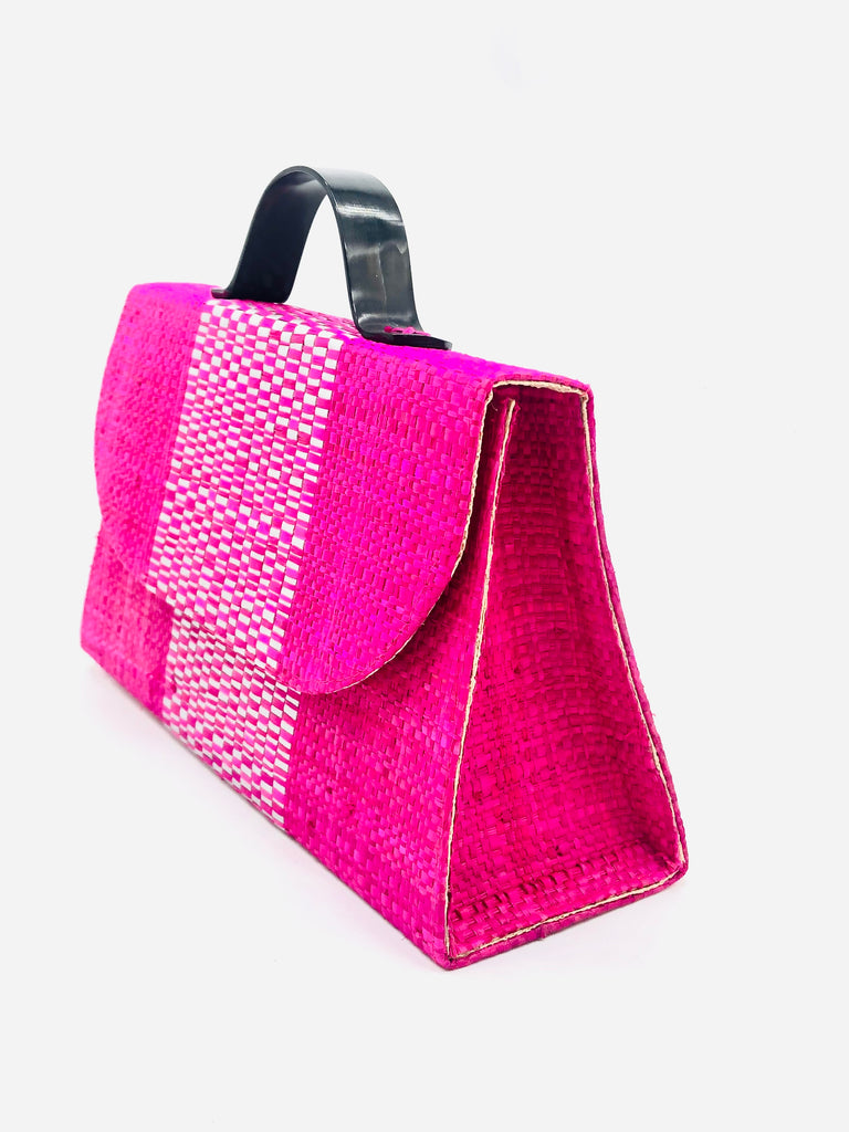 Side view Wynwood Fuchsia Straw Handbag with Metallic Detailing & Horn Handle handmade loomed raffia in fuchsia pink and silver metallic vegan leather in three vertical bands of color with the metallic weave centered on the purse under the handles - Shebobo