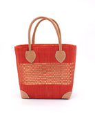 Wynwood Coral Straw Basket Bag with Metallic Detailing Handmade loomed raffia palm fiber in a solid hue of coral orange/red with a wide horizontal band of metallic strands woven in seamlessly handbag purse with leather handles - Shebobo
