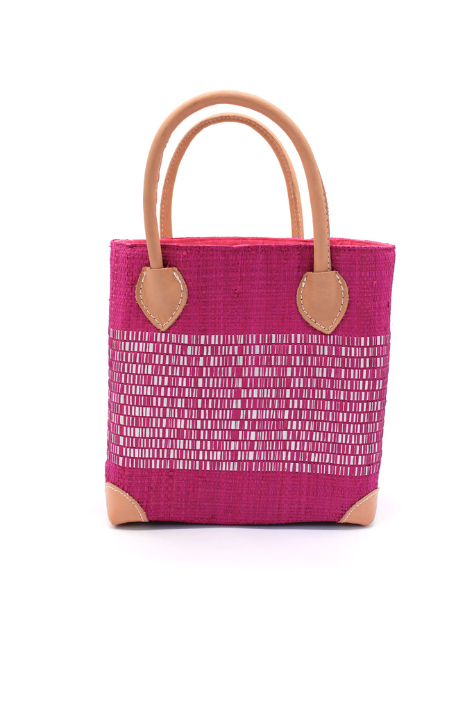 Wynwood Fuchsia Straw Basket Bag with Metallic Detailing Handmade loomed raffia palm fiber in a solid hue of fuchsia bright/hot/barbie/pink with a wide horizontal band of metallic strands woven in seamlessly handbag purse with leather handles - Shebobo