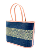 Side View Wynwood Black Straw Basket Bag Handbag with Metallic Detailing handmade loomed raffia in black and silver metallic vegan leather in three evenly sized horizontal bands of color with the metallic weave centered on the purse with leather binding and handles - Shebobo