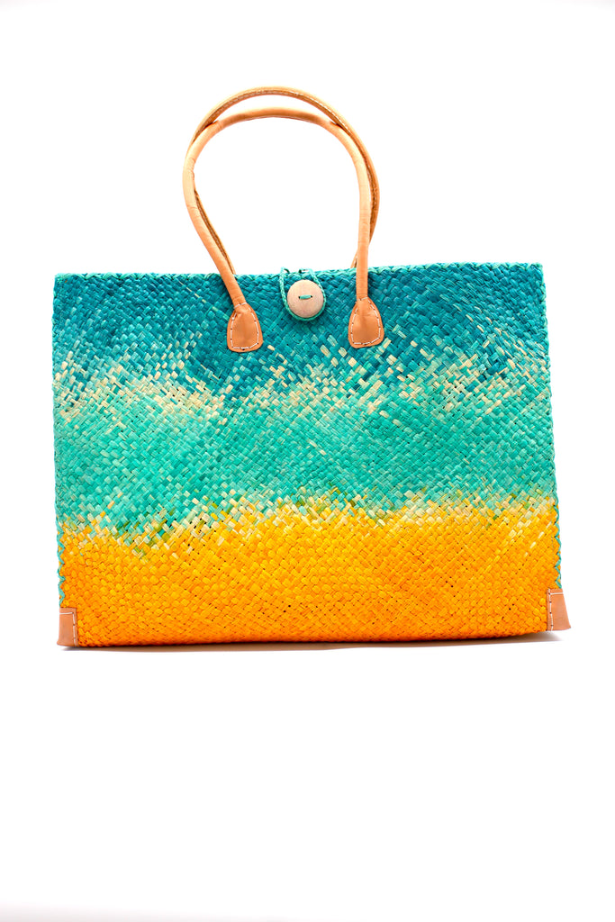 Holden Turquoise Ombre Zafran Large Straw Beach Bags handmade dip dyed raffia woven into a three part horizontal ombre pattern of turquoise blue on the top, seafoam blue/green in the middle and both sides, and saffron yellow on the bottom with cross stitch edging, wooden button, and leather handles - Shebobo