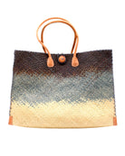 Holden Black Ombre Zafran Straw Beach Bags handmade dip dyed raffia woven into a three part horizontal ombre pattern of black on the top, grey in the middle and both sides, and natural on the bottom with cross stitch edging, wooden button, and leather handles - Shebobo