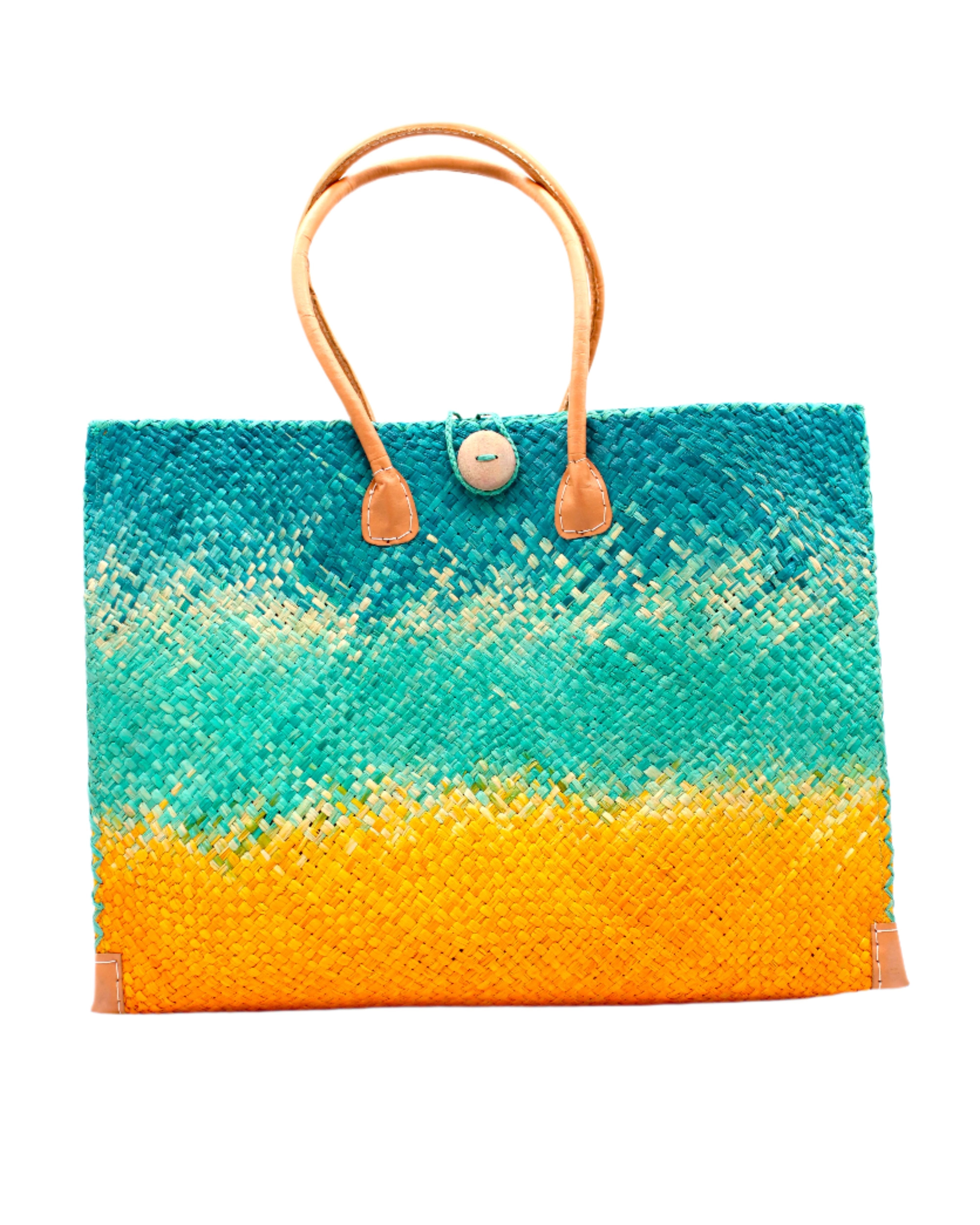 Holden Turquoise Ombre Zafran Straw Beach Bags handmade dip dyed raffia woven into a three part horizontal ombre pattern of turquoise blue on the top, seafoam blue/green in the middle and both sides, and saffron yellow on the bottom with cross stitch edging, wooden button, and leather handles - Shebobo